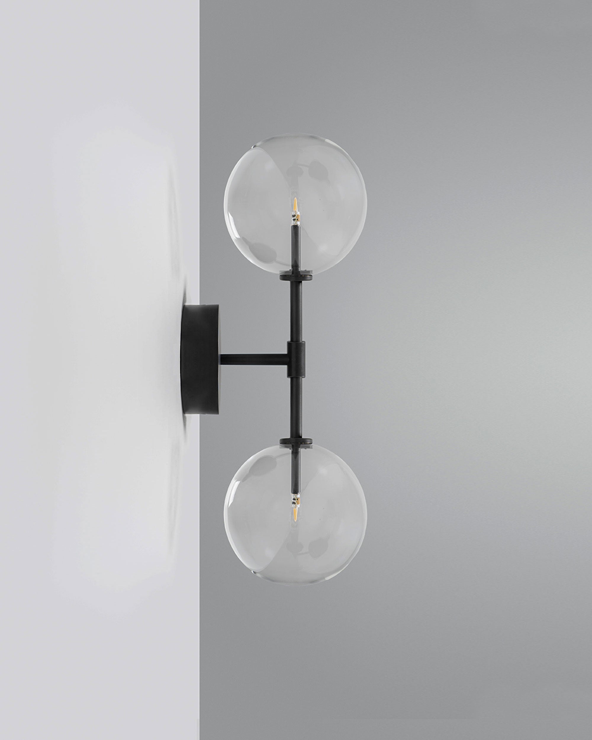 Schwung Dawn Dual Black Gunmetal Transparent Globe Wall Light